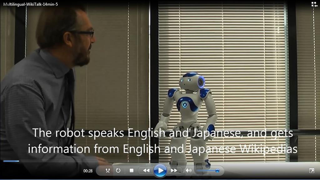 Graham Wilcock with a talking robot
