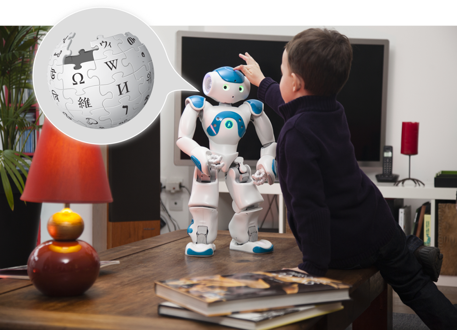 A child using WikiTalk with a robot