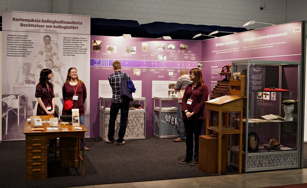 The exhibition booth of the University Museum at the Doctor 2014 event featured objects in display cases as well as printouts and images on the walls.