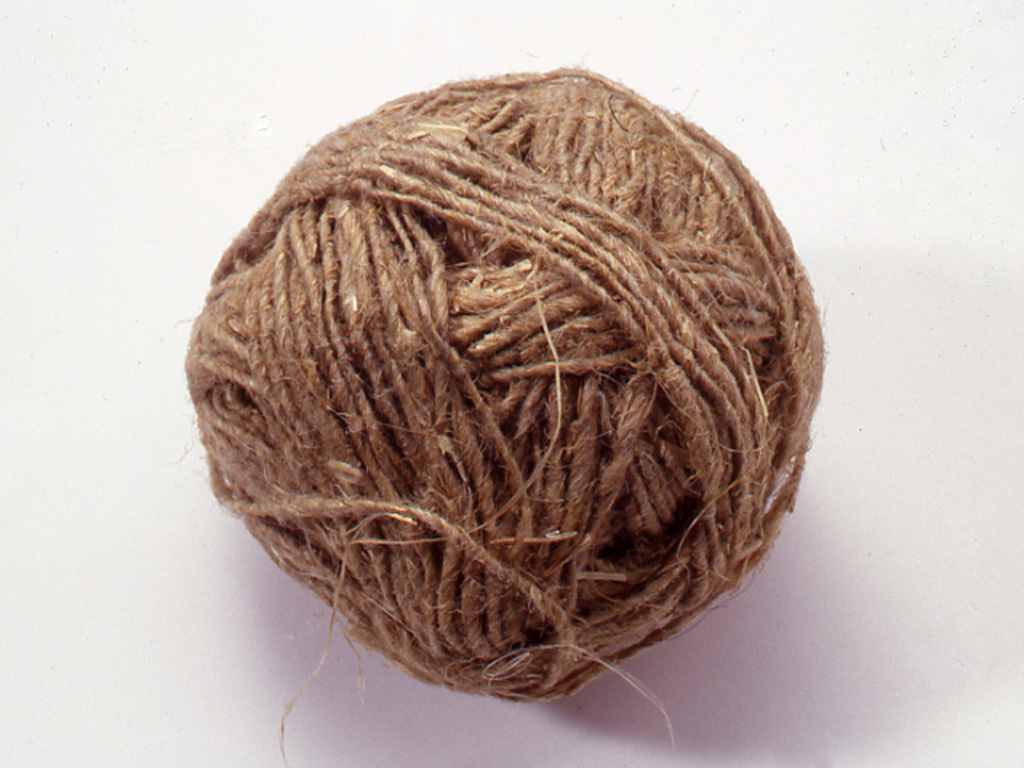 A round ball of brownish dense yarn.