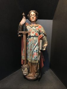 Wooden sculpture of St Catherine of Alexandria with the head of Emperor Maxentius