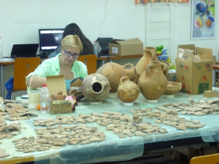 Photo 4. Irina Gutman, the pottery restorer of the Kinneret Regional Project, is busy restoring various vessels found during excavations on Tel Kinrot (© Kinneret Regional Project; photo: Rick Bonnie).