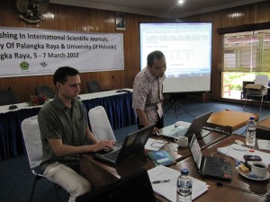 Dr. Larjavaara and a participant showing group work