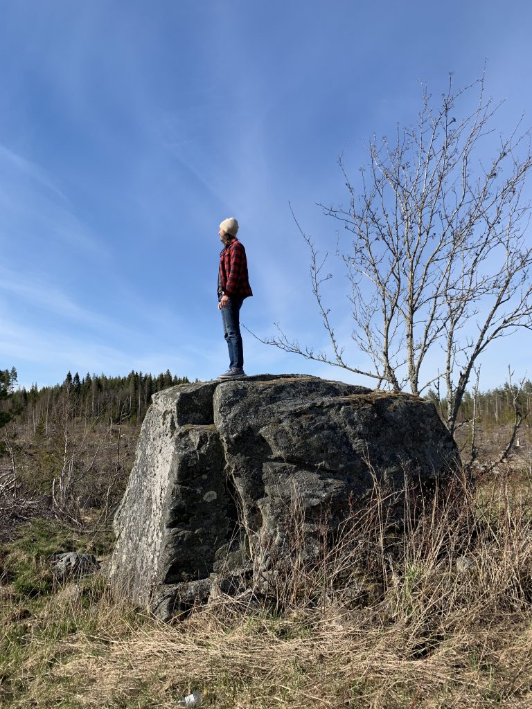 Person standing on a big rock