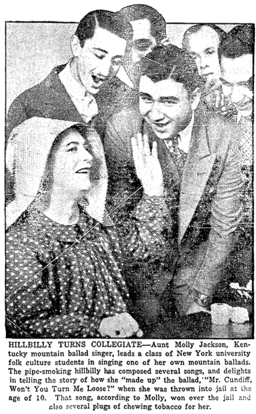 Black and white newspaper clip portraying five men standing and leaning towards sitting Aunt Molly Jackson. They seem to be singing. Image caption: "Hillbilly turns collegiate- Aunt Molly Jackson, Kentucky mountain ballad singer, leads a class of New York university folk culture students in singing one of her own mountain ballads. The pipe-smoking hillbilly has composed several songs, and delights in telling the story of how she "made up" the ballad "Mr. Cundiff, Won't You Turn Me Loose?" when she was thrown into jail at the age of 10. That song, according to Molly, won over the jail and [blank] also several plugs of chewing tobacco for her."